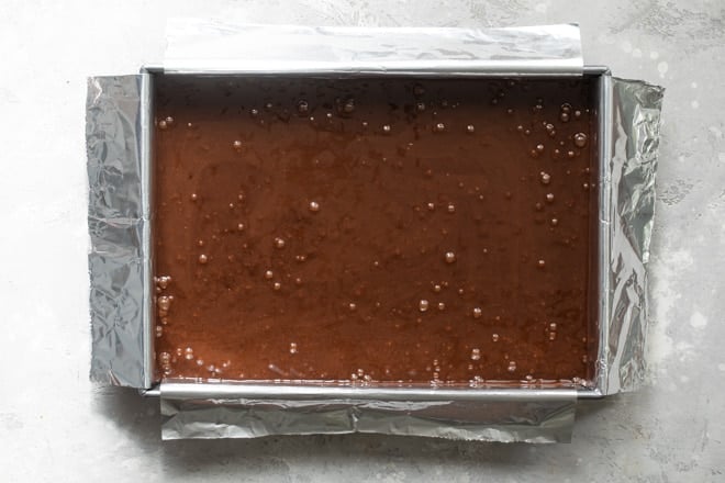 Brownie batter in a pan.