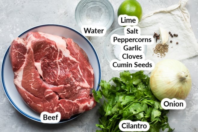 Birria ingredients in various bowls.