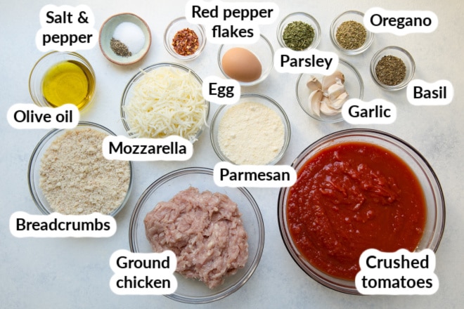 Chicken Parmesan ingredients in bowls and labeled.