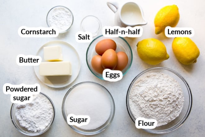 Labeled lemon bar ingredients in bowls.