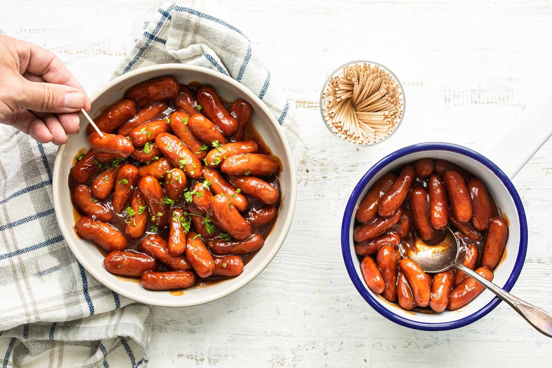 2 ingredient barbecue little smokies in two white bowl.