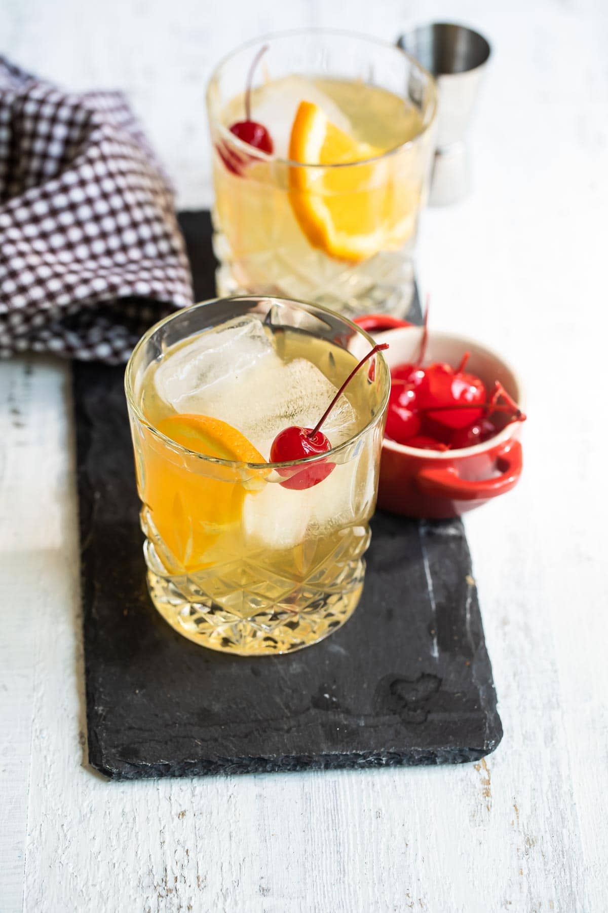 An amaretto sour cocktail in a clear glass.