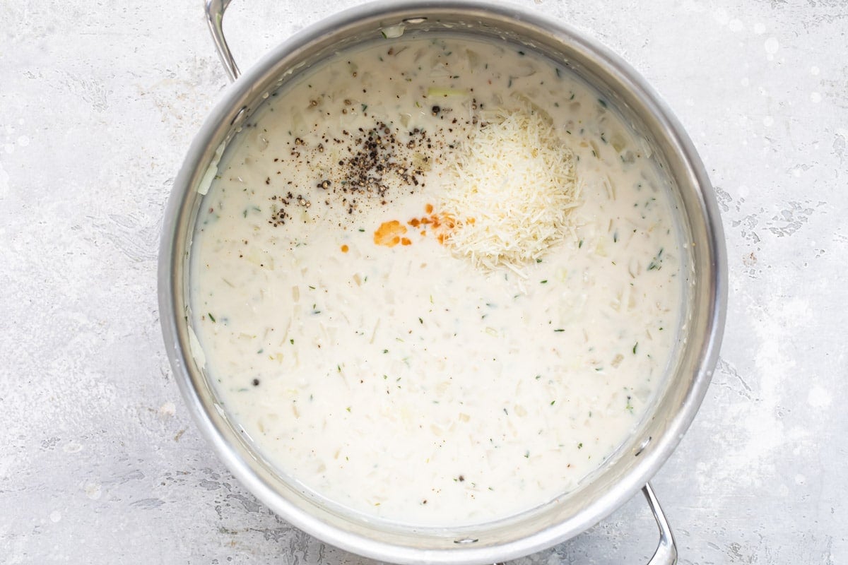 Chicken tetrazzini sauce in a silver stock pot.