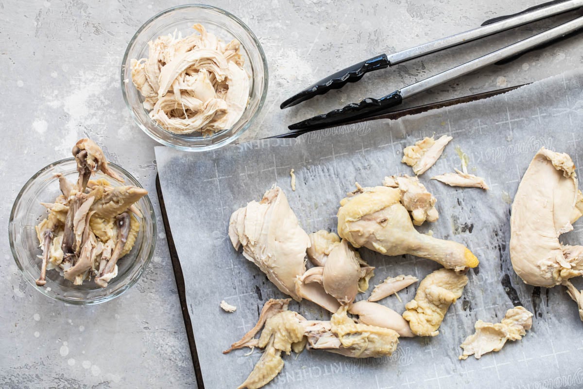Pieces of chicken on parchment paper.