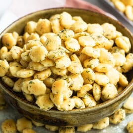 Ranch oyster crackers in a brown bowl.