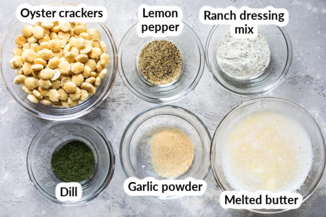 Labeled ingredients for ranch oyster crackers in various bowls.
