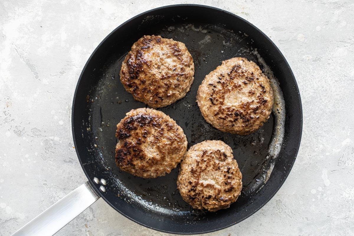 Browned salisbury steaks in a skillet