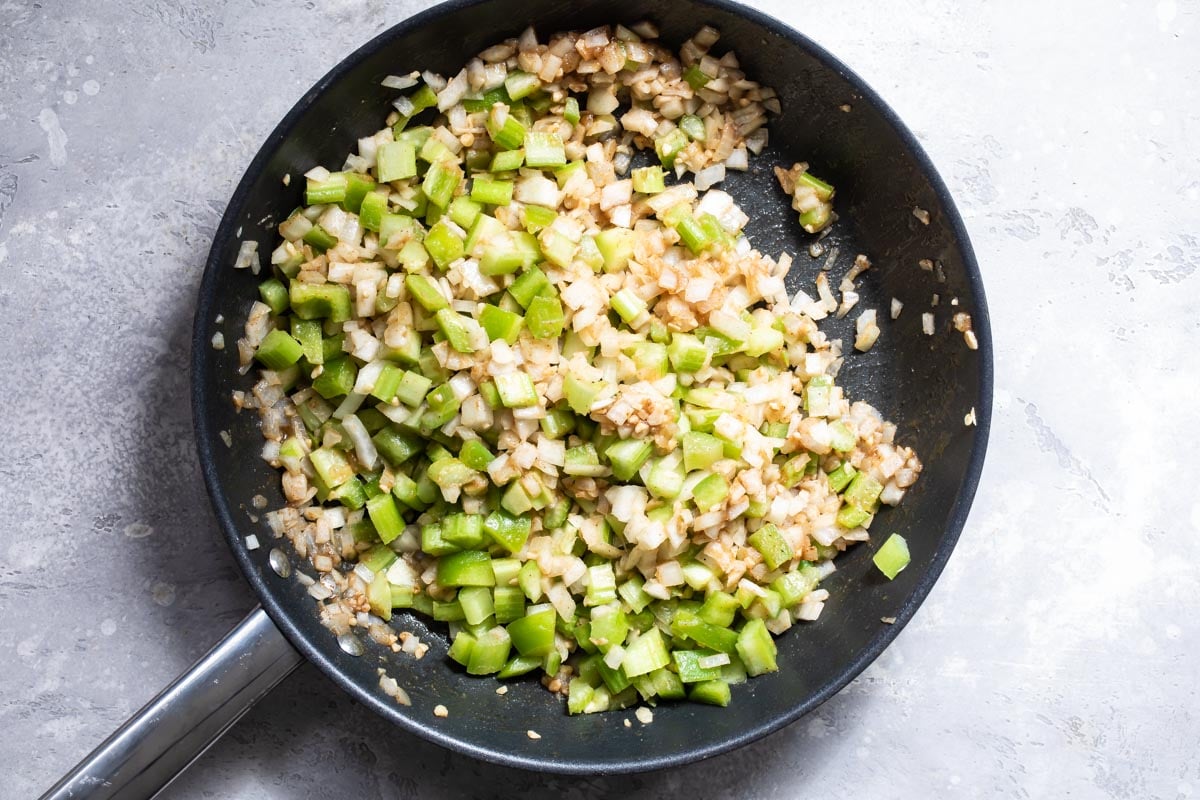 Cooked vegetables in a black skillet.