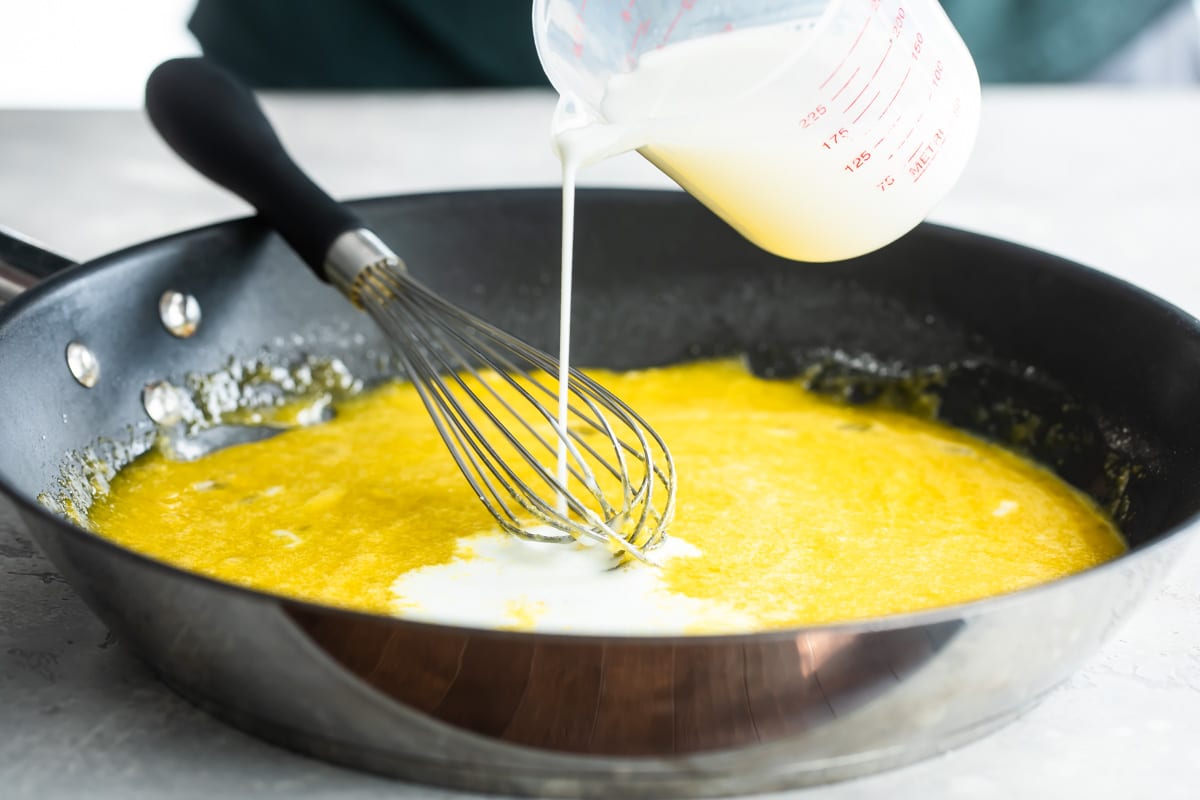 Making tiramisu custard in a pan.