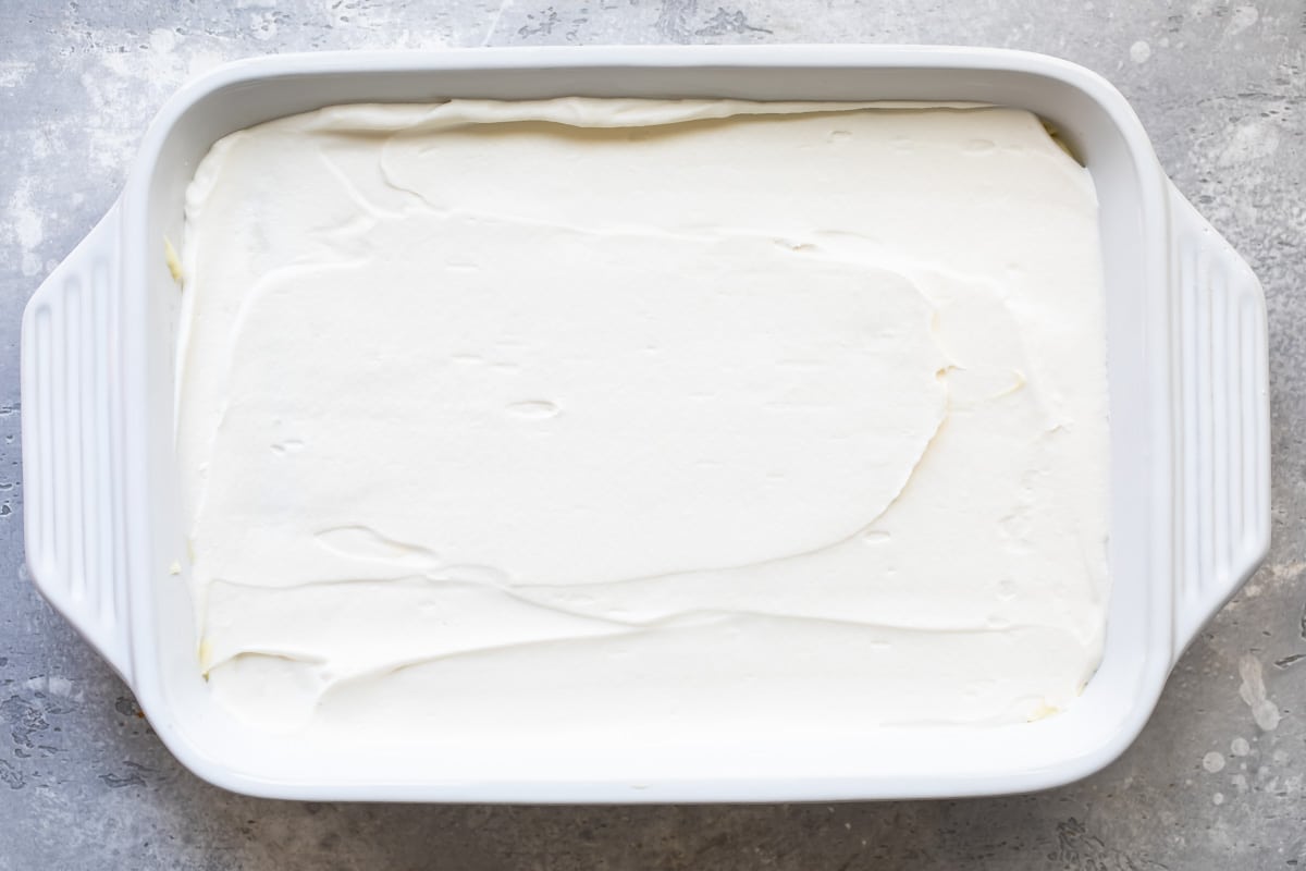 Whipped cream on tiramisu.