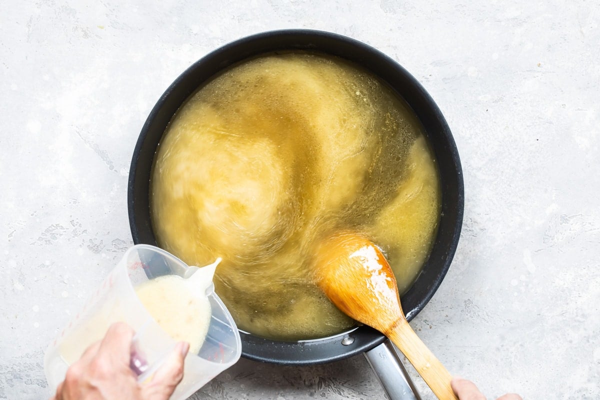 Thickening turkey gravy with a cornstarch slurry.