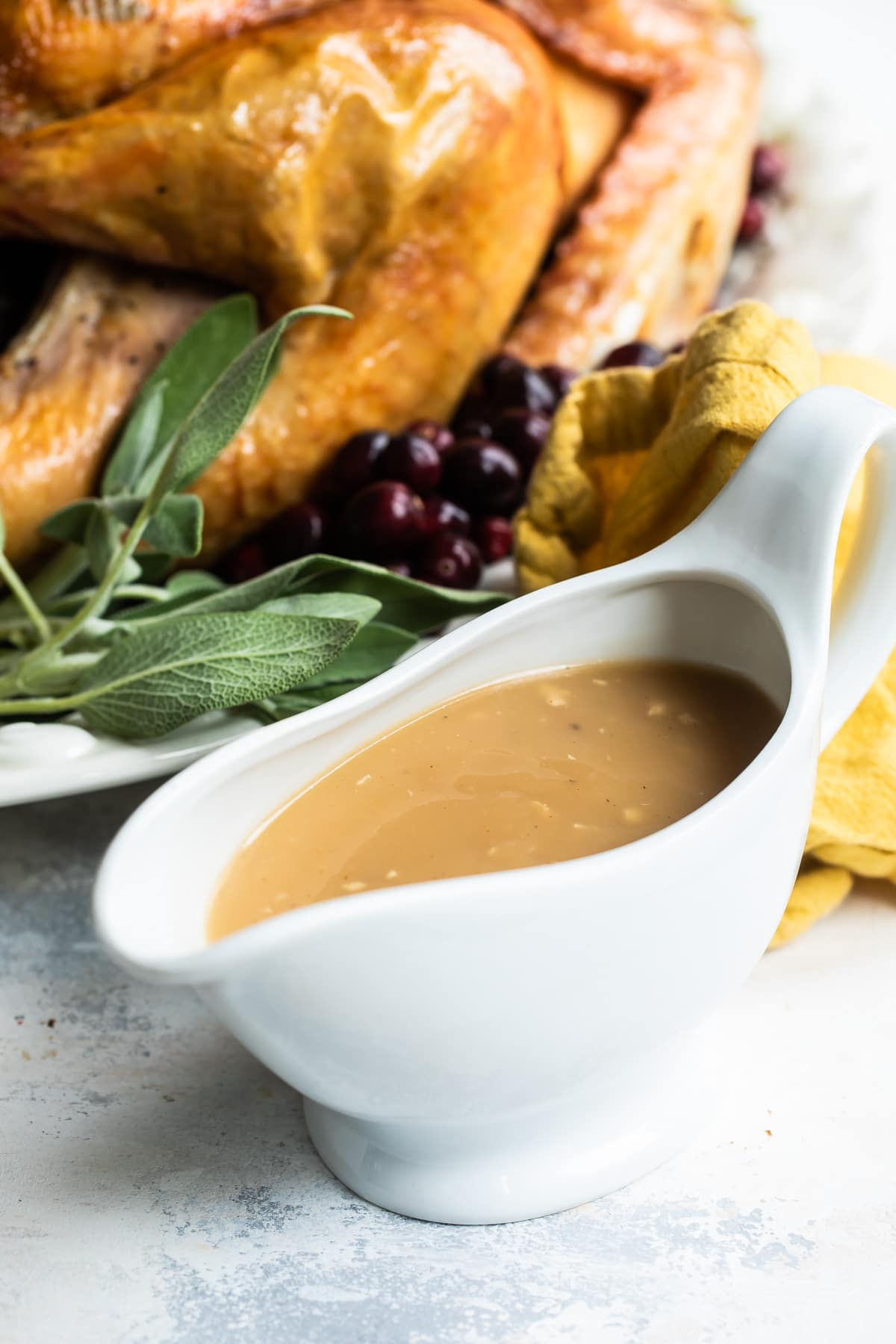 Turkey gravy in a white gravy boat.
