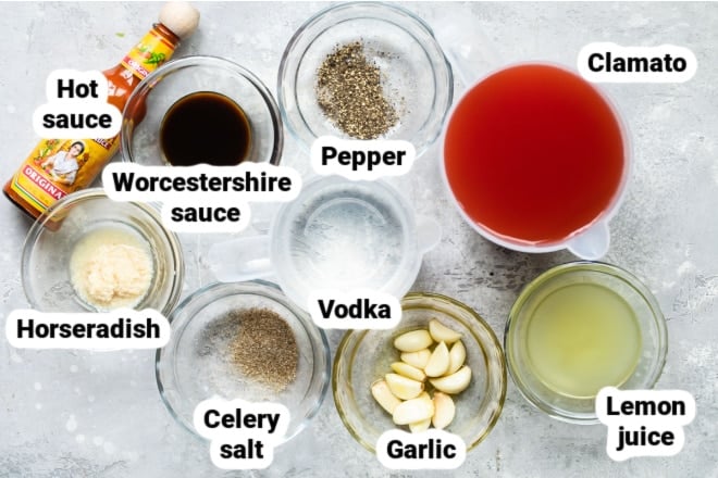 Labeled Bloody Mary ingredients in various bowls.