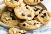 Cranberry cookies with white chocolate on a gray plate.