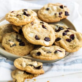 Cranberry cookies with white chocolate on a gray plate.