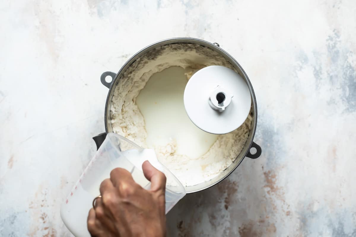 Making cinnamon roll dough in a stand mixer.