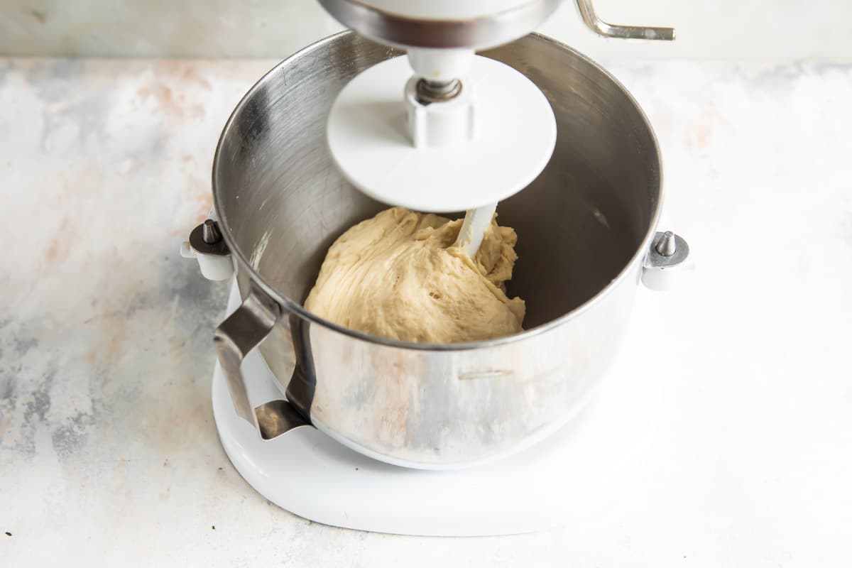 Cinnamon roll dough in a stand mixer.
