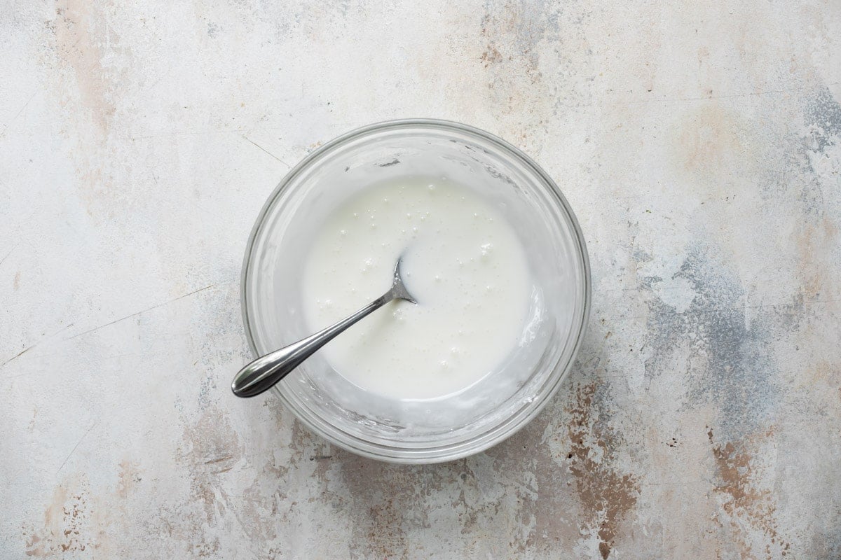 Cream cheese icing in a bowl.
