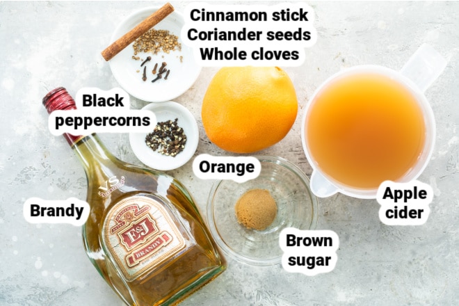 Mulled cider ingredients in bowls and labeled.