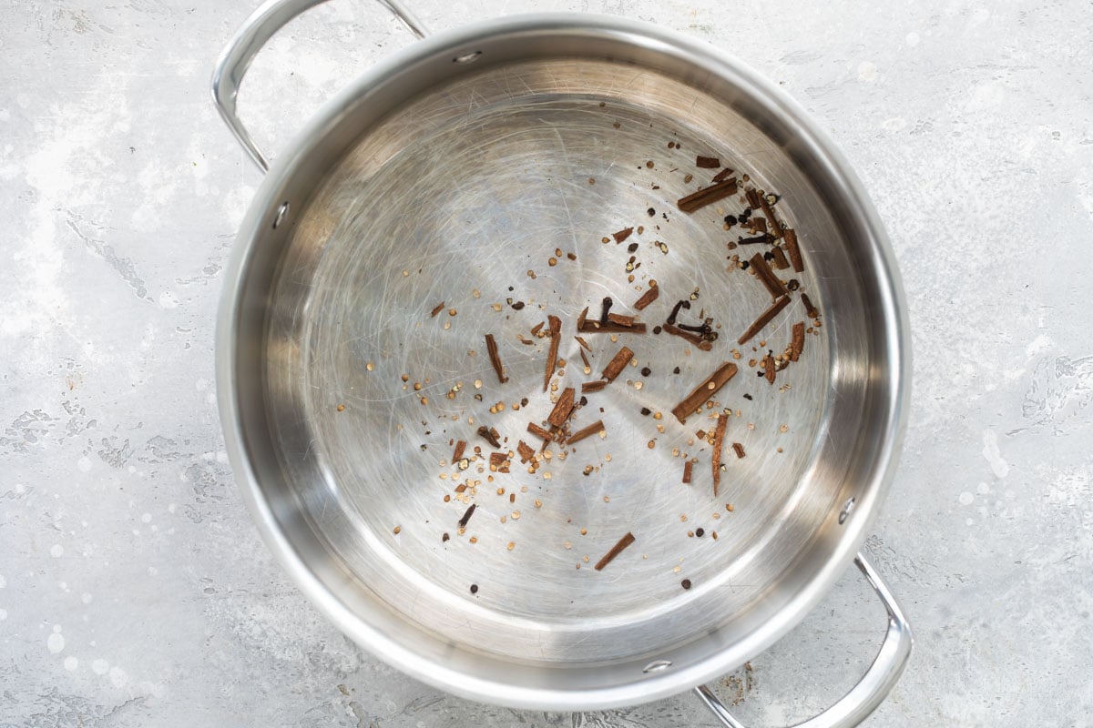 Spices in a silver stock pot.