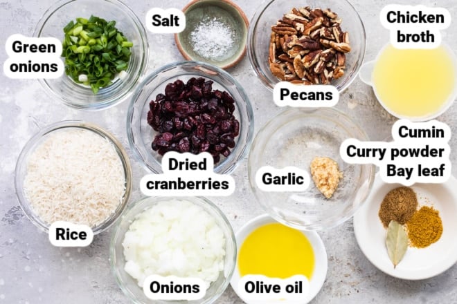 Labeled rice stuffing ingredients in various bowls.