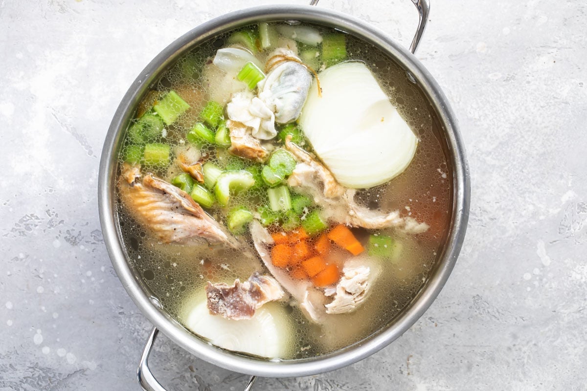 Turkey broth ingredients in a stock pot.