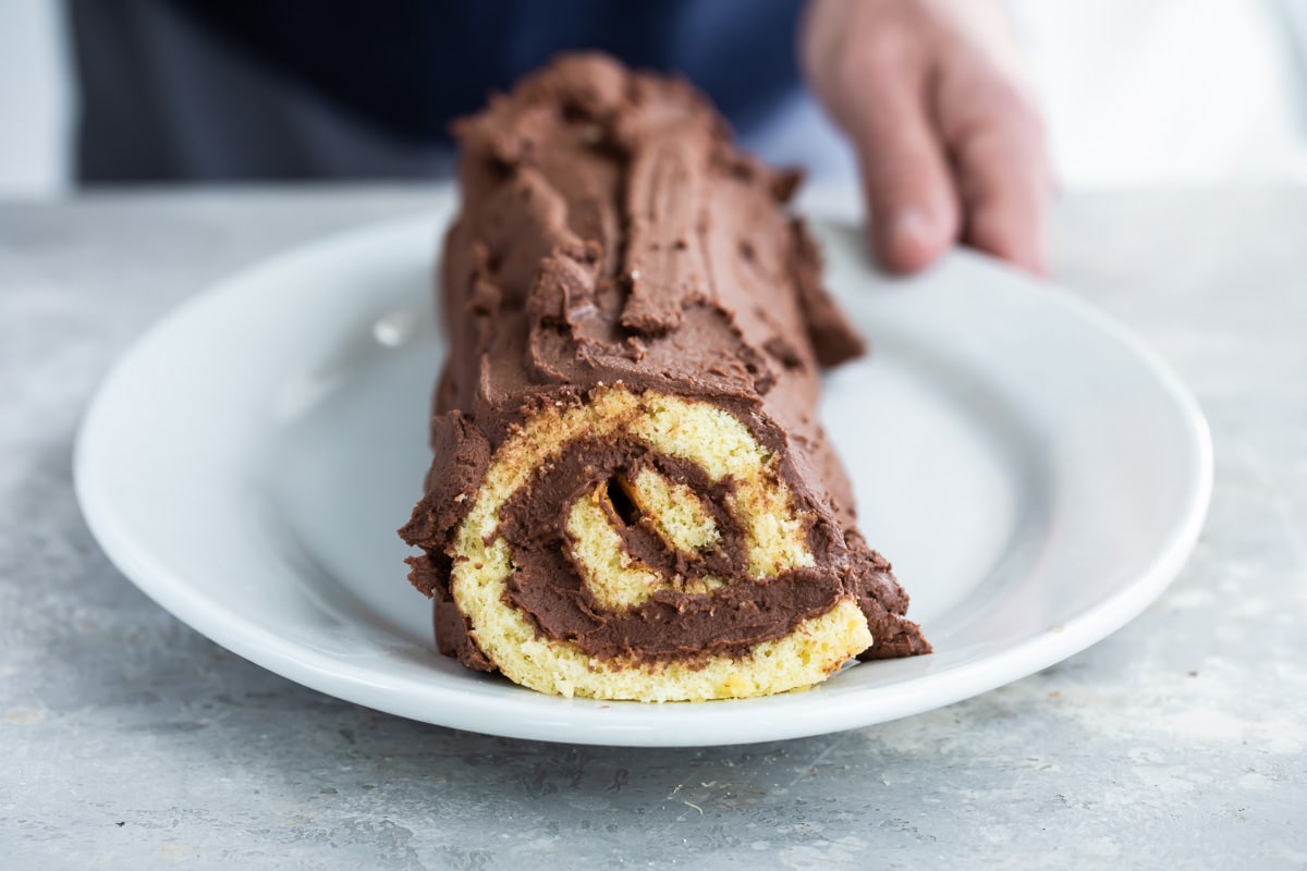 A Buche de Noel (yule log cake) on a platter.