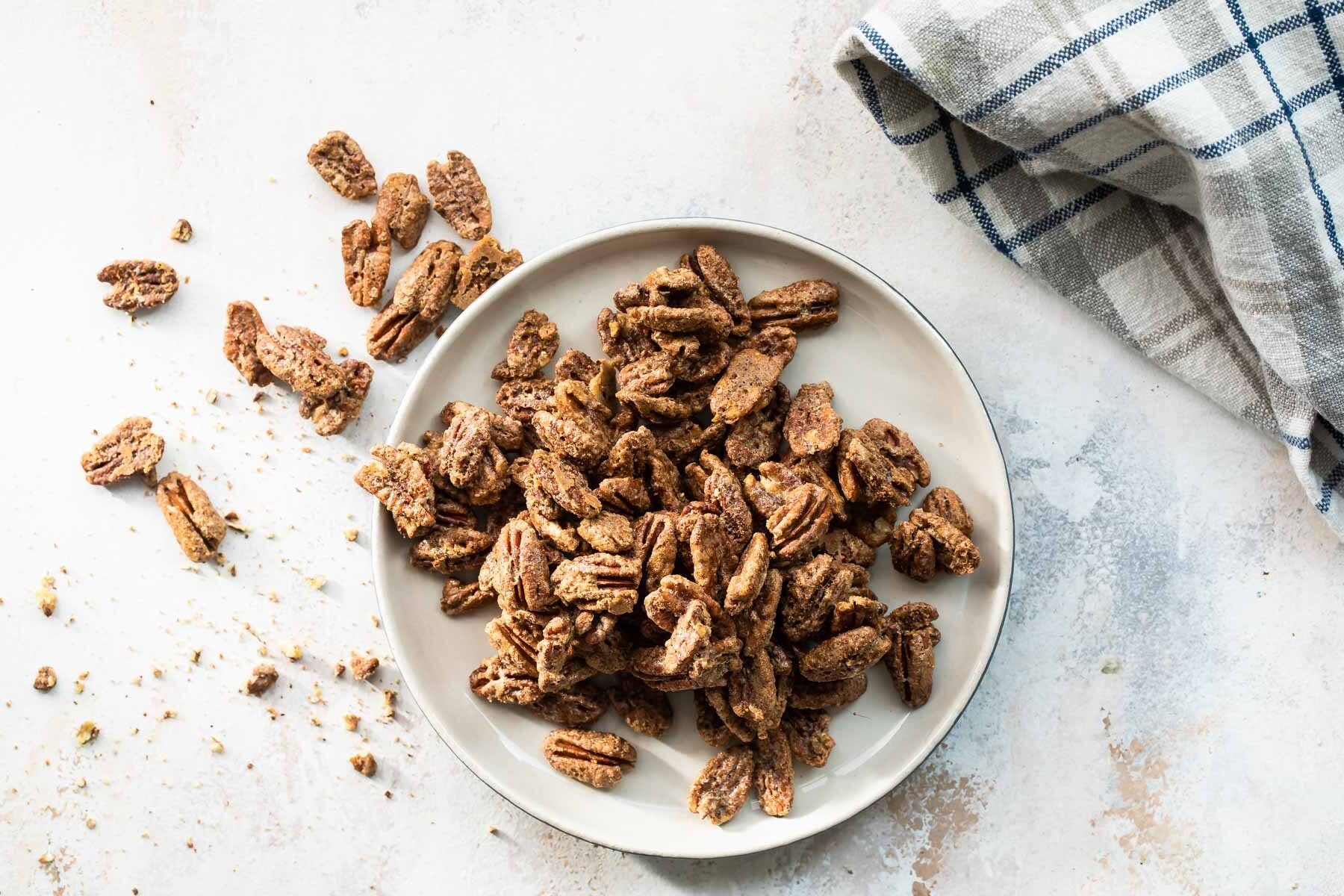 Candied pecans on a plate.