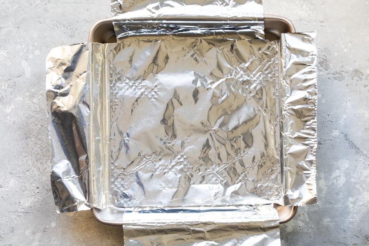 A 9-inch square baking pan lined with foil.