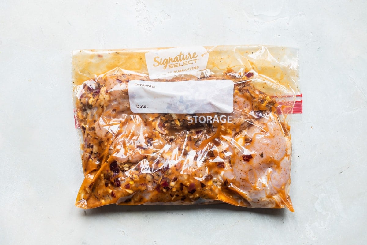 Chipotle chicken marinating in a ziploc bag.