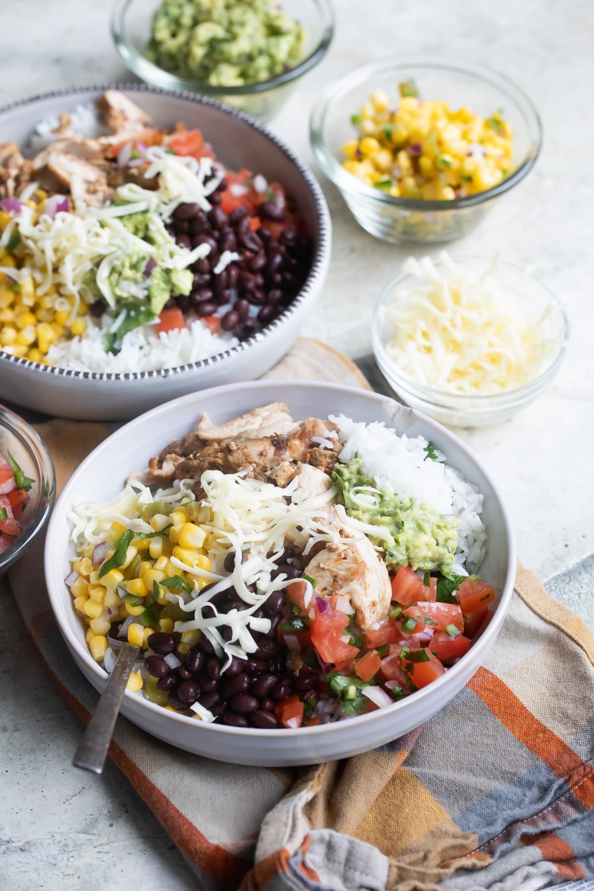 Chipotle burrito bowls in white bowls.