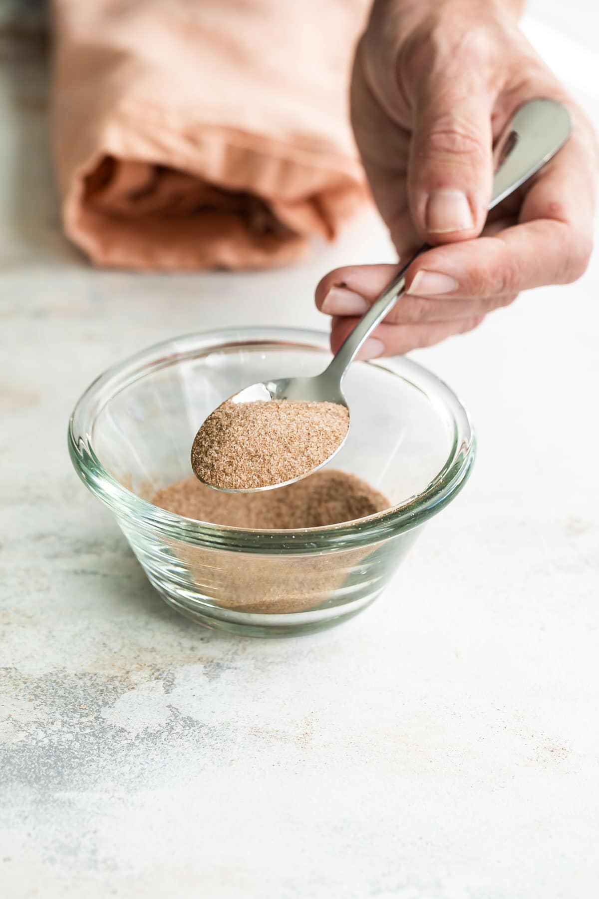 A bowl of cinnamon sugar topping.