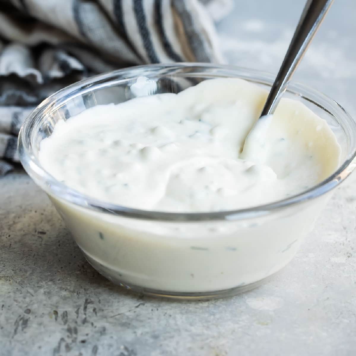 A bowl of blue cheese dressing.