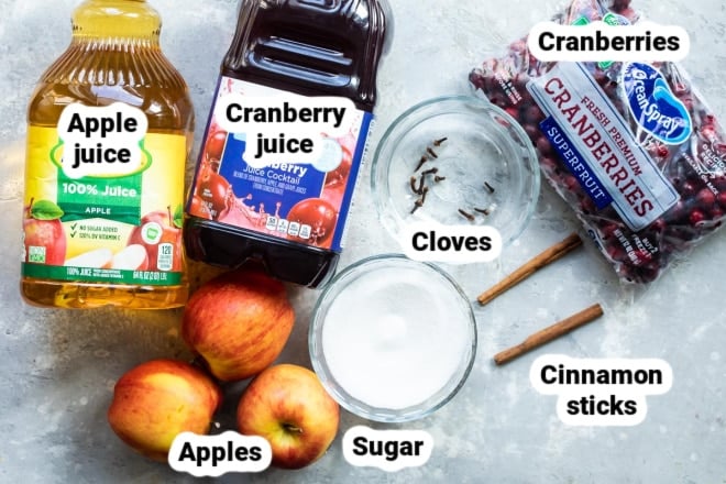 Labeled slow cooker cranberry apple cider ingredients.