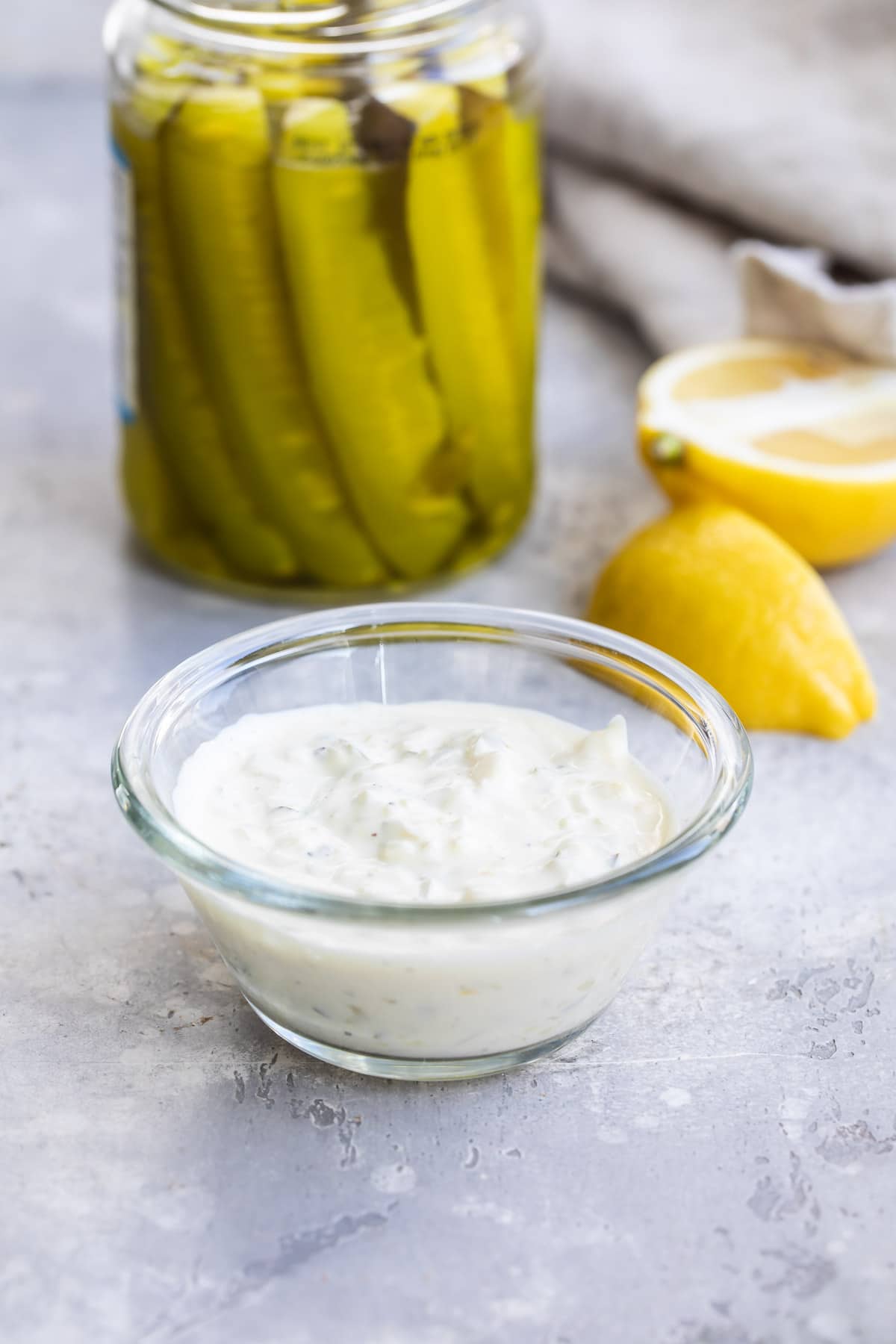 Tartar sauce in a small clear portion cup.
