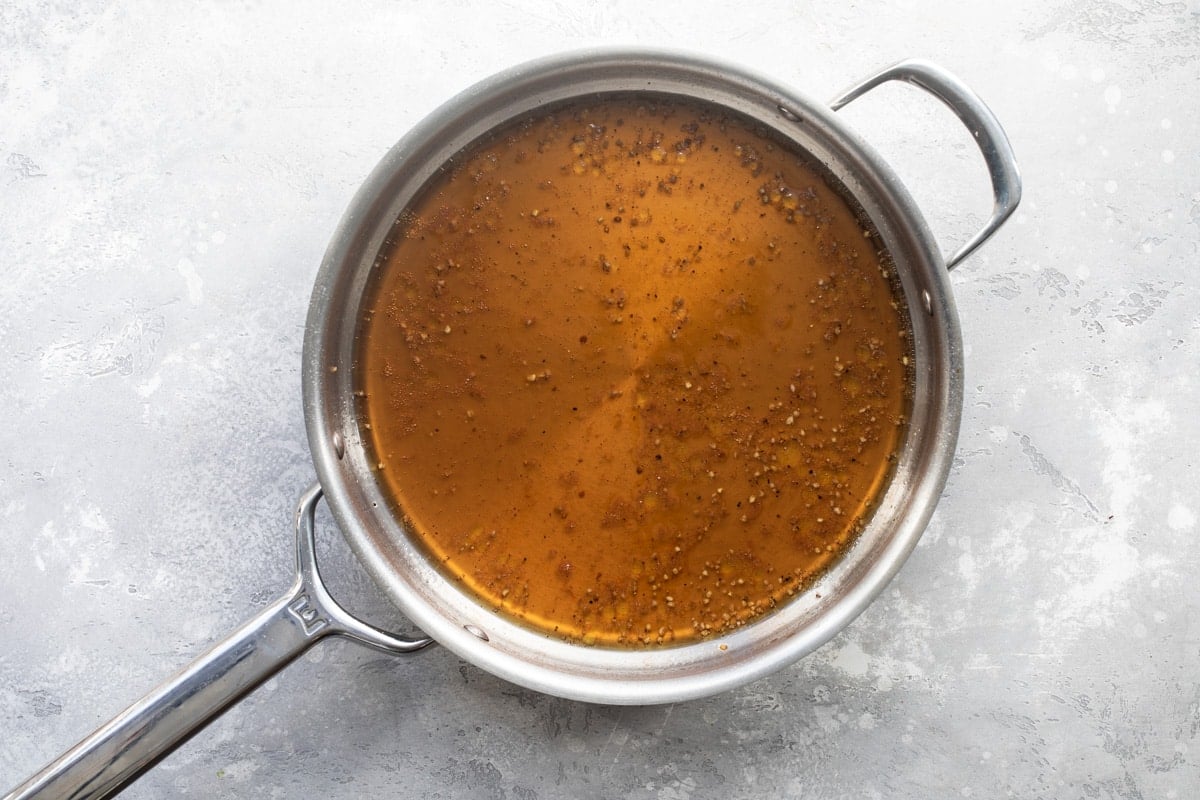 Vinegar sauce in a pan for bean salad.