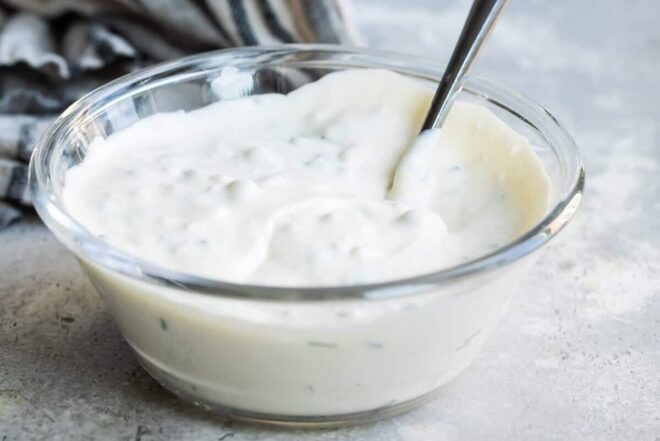 A bowl of blue cheese dressing.