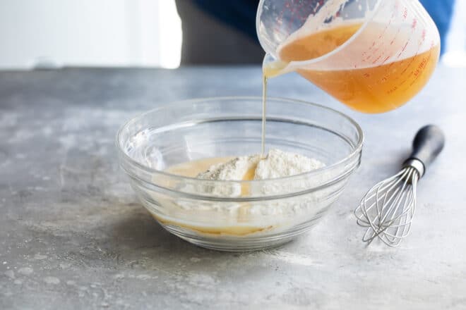 Mixing up beer batter for fish.