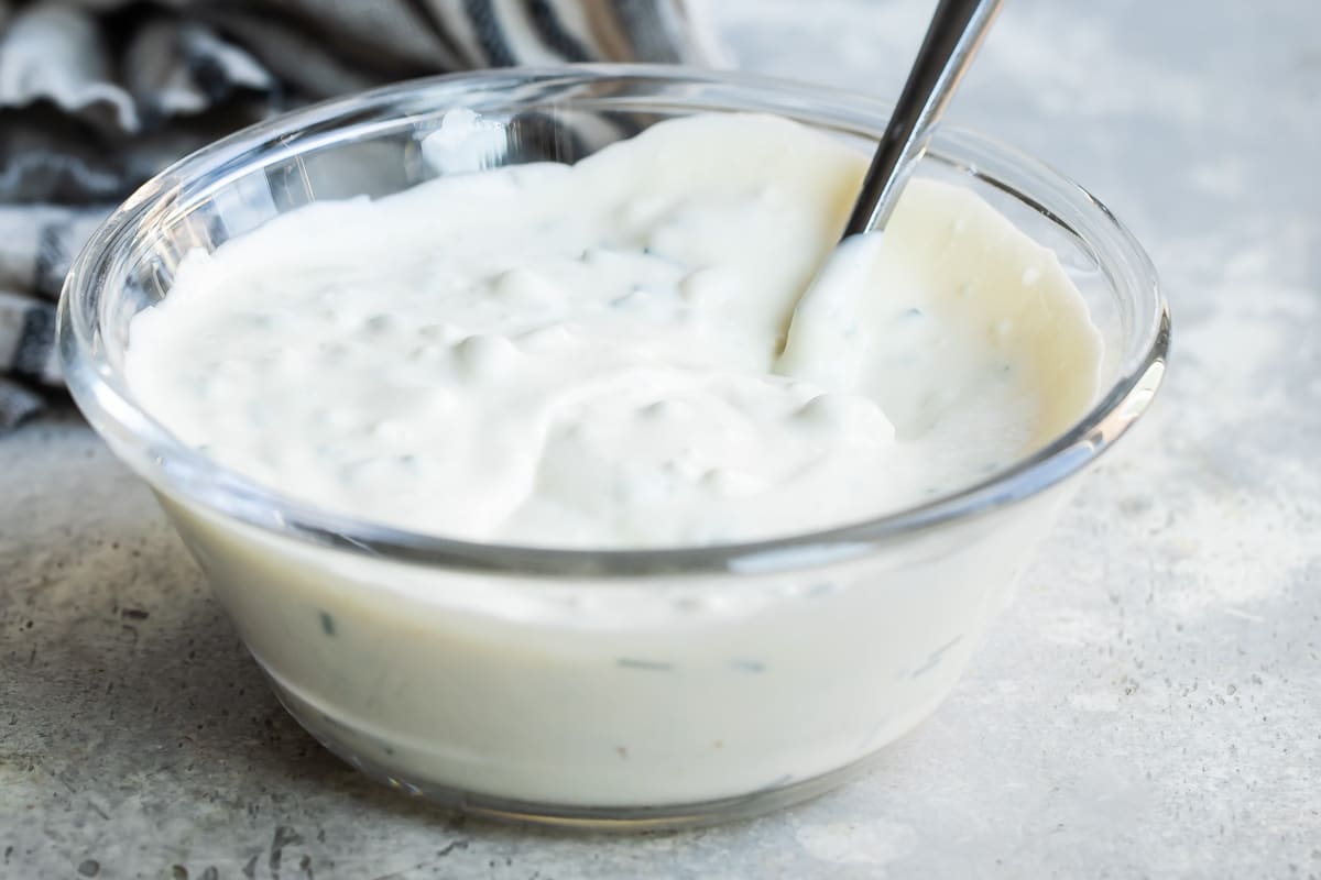 A bowl of blue cheese dressing.