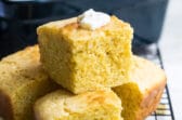 Four pieces of cornbread on a cooling rack.