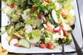 Easy garden salad on a white platter.