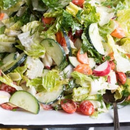 Easy garden salad on a white platter.