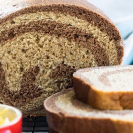 Marble rye bread on a cooling rack.