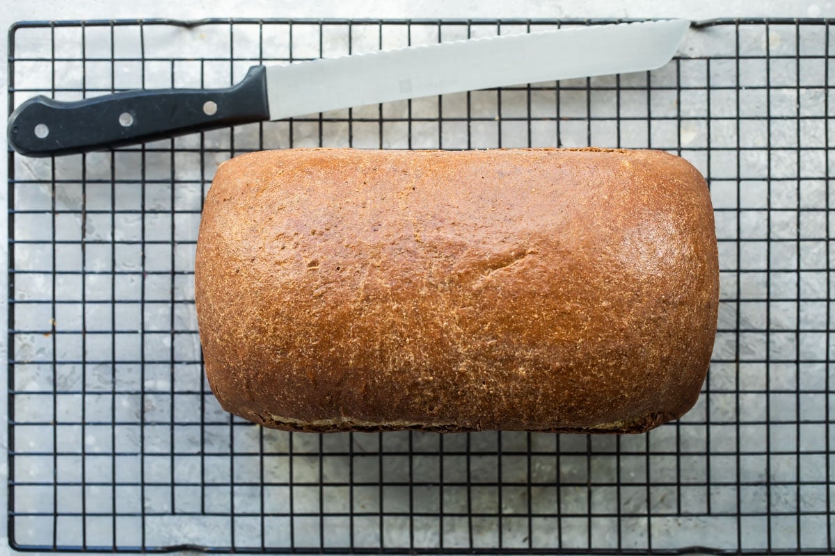 Marble rye bread on a cooling rack.