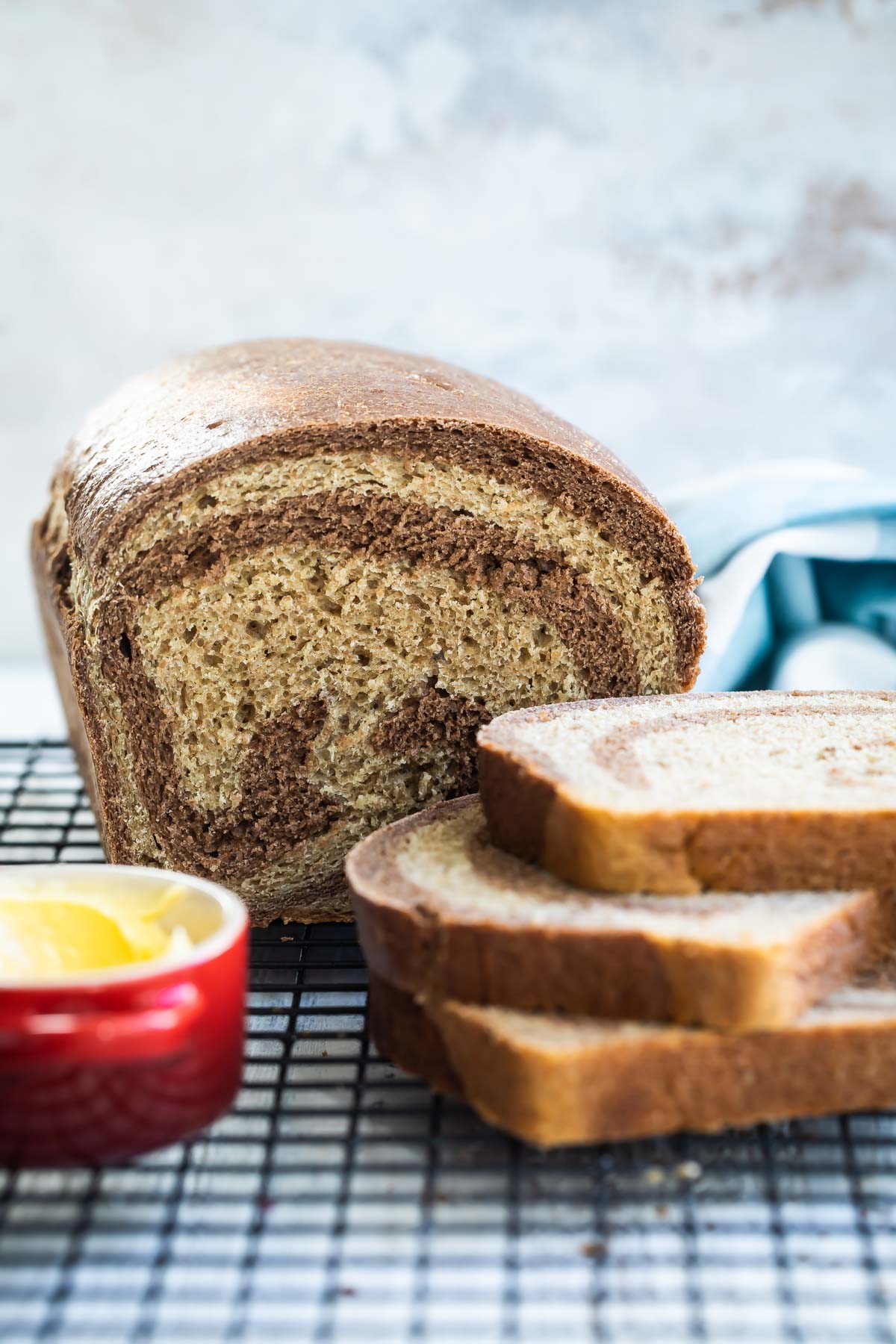 Marble rye bread on a cooling rack.