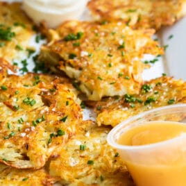 Potato latkes on a rectangular platter.