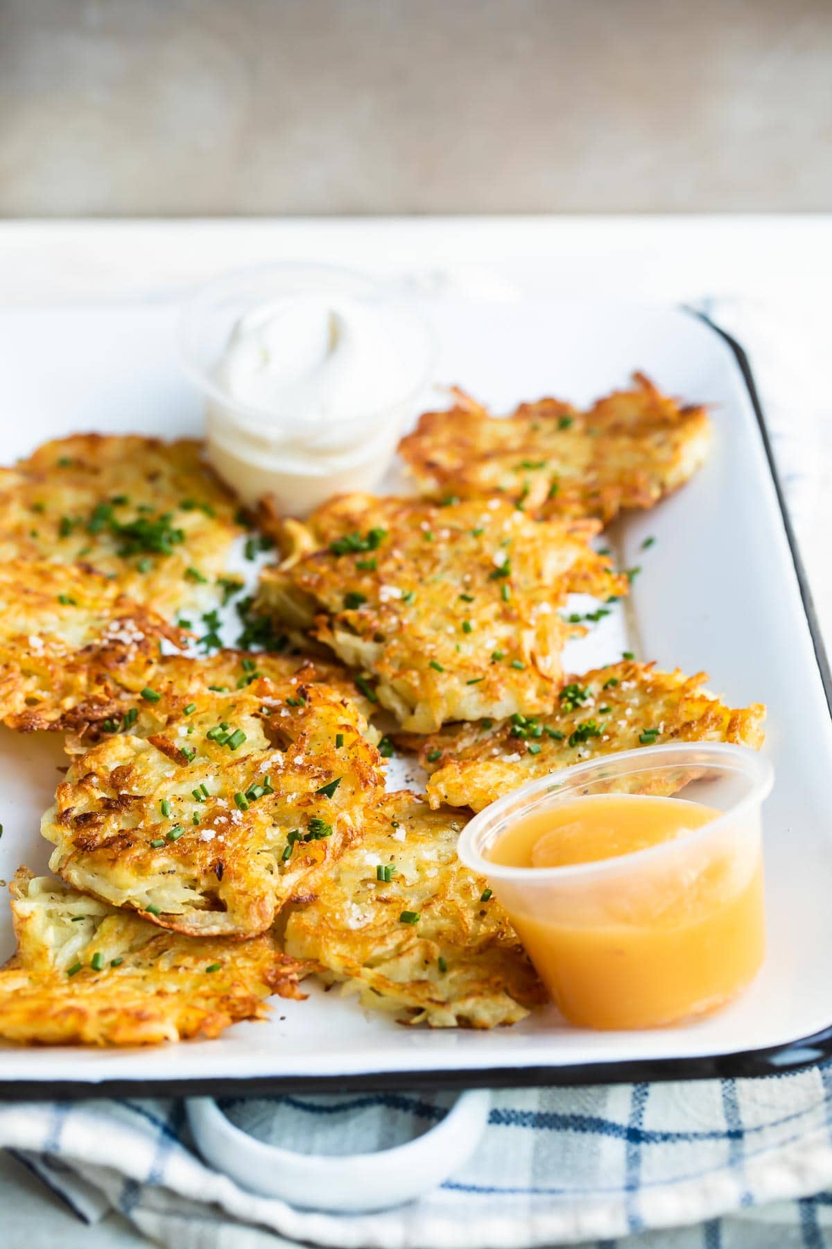 Potato latkes on a rectangular platter.