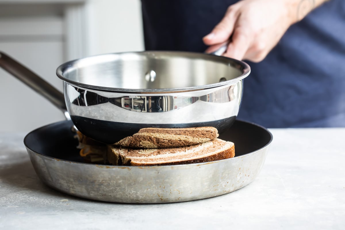 A rachel sandwich in a skillet.
