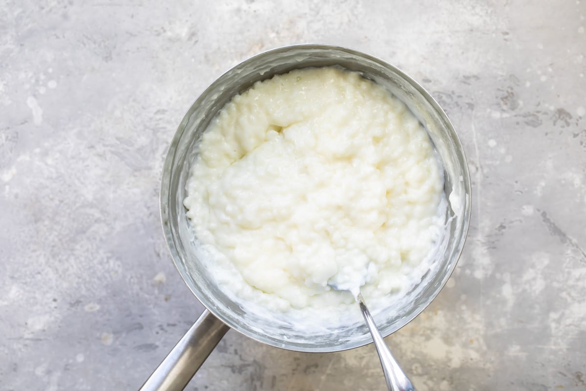 Tapioca pudding in a silver saucepan.