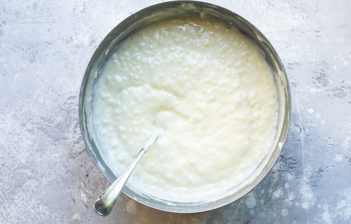 Tapioca pudding in a silver bowl.